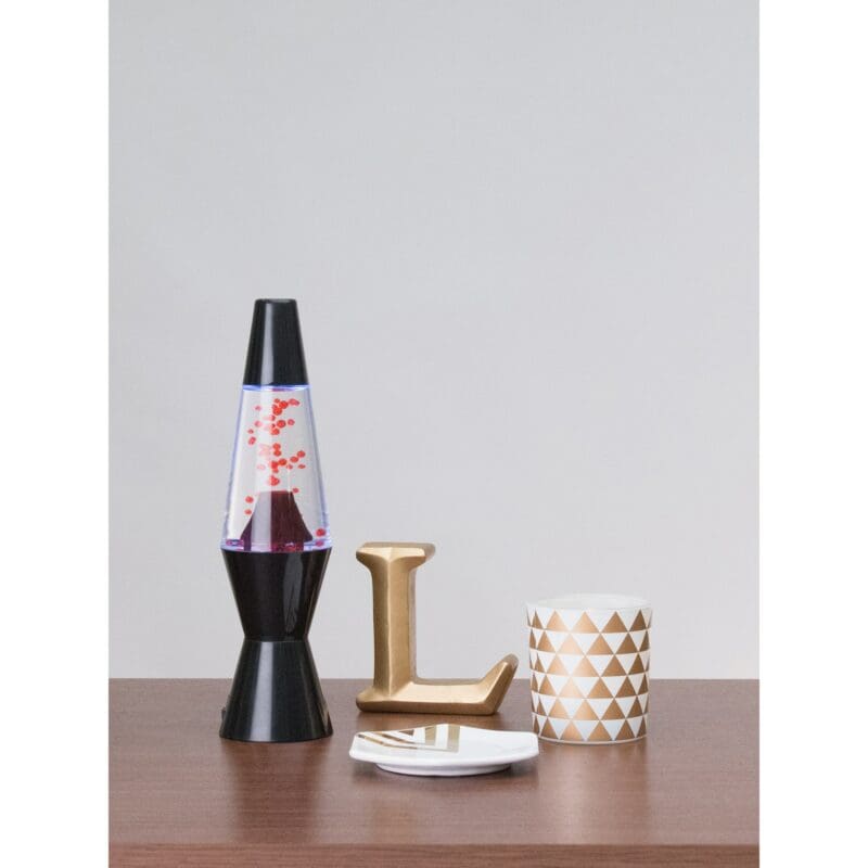 71030400US-LavaLamp-10-Volcano-web 10” LAVA® Lamp Volcano – Black Base - Lifestyle on display table